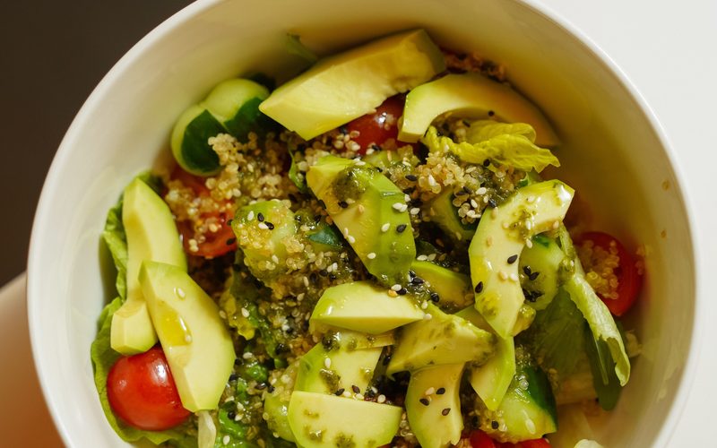 Bowl of salmon, greens and avocado